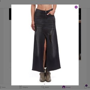 Distressed fit and flare long black denim skirt. Very edgy style.